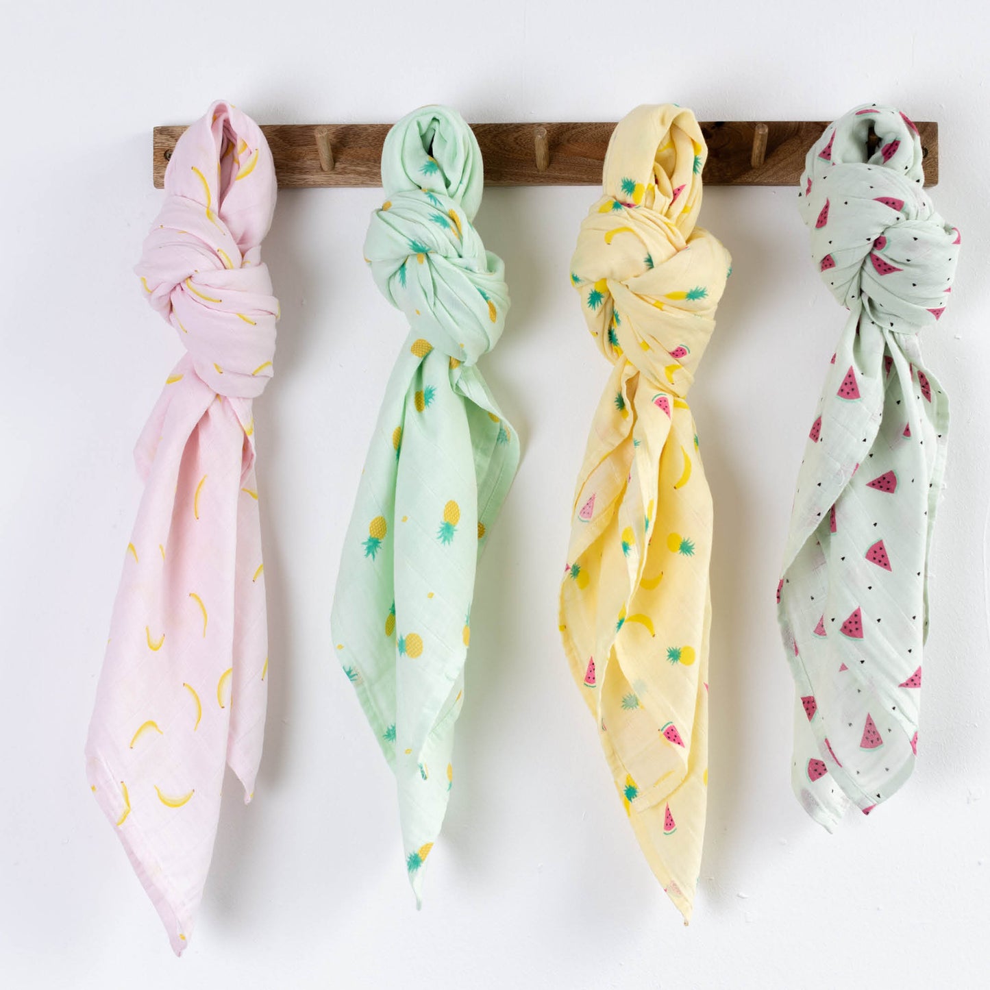 CuddleBug Muslin Cotton Swaddle Blankets (4 Pack) – Tutti Frutti design. Made from 100% premium muslin cotton, these extra-large, breathable 4x4 ft swaddles provide lightweight comfort and cozy security for better sleep.