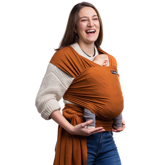 CuddleBug Original Baby Wrap – Brown. A soft, stretchy cotton-spandex baby wrap for newborns to toddlers (7-35 lbs). Provides hands-free comfort, even weight distribution, and a secure, snug fit for all body types.