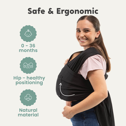 CuddleCarry™ Easy-Wear Baby Wrap Carrier in Black – a lightweight, T-shirt-style baby wrap offering a snug, hands-free fit for newborns to toddlers (8-35 lbs). Ergonomic, adjustable, and designed for all body types (XS-XXL).