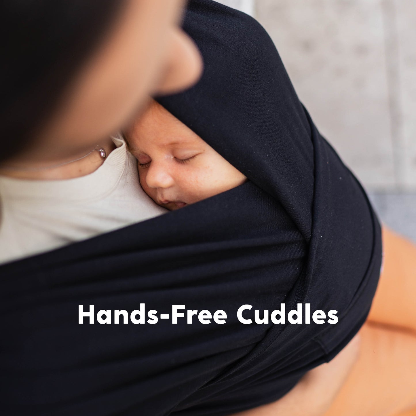 CuddleCarry™ Easy-Wear Baby Wrap Carrier in Black – a lightweight, T-shirt-style baby wrap offering a snug, hands-free fit for newborns to toddlers (8-35 lbs). Ergonomic, adjustable, and designed for all body types (XS-XXL).